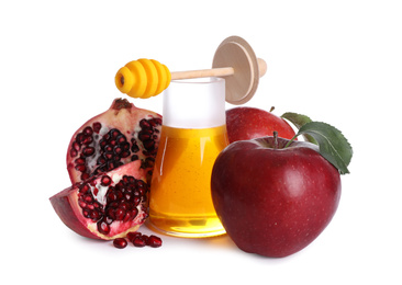 Photo of Honey, apples and pomegranate on white background. Rosh Hashanah holiday