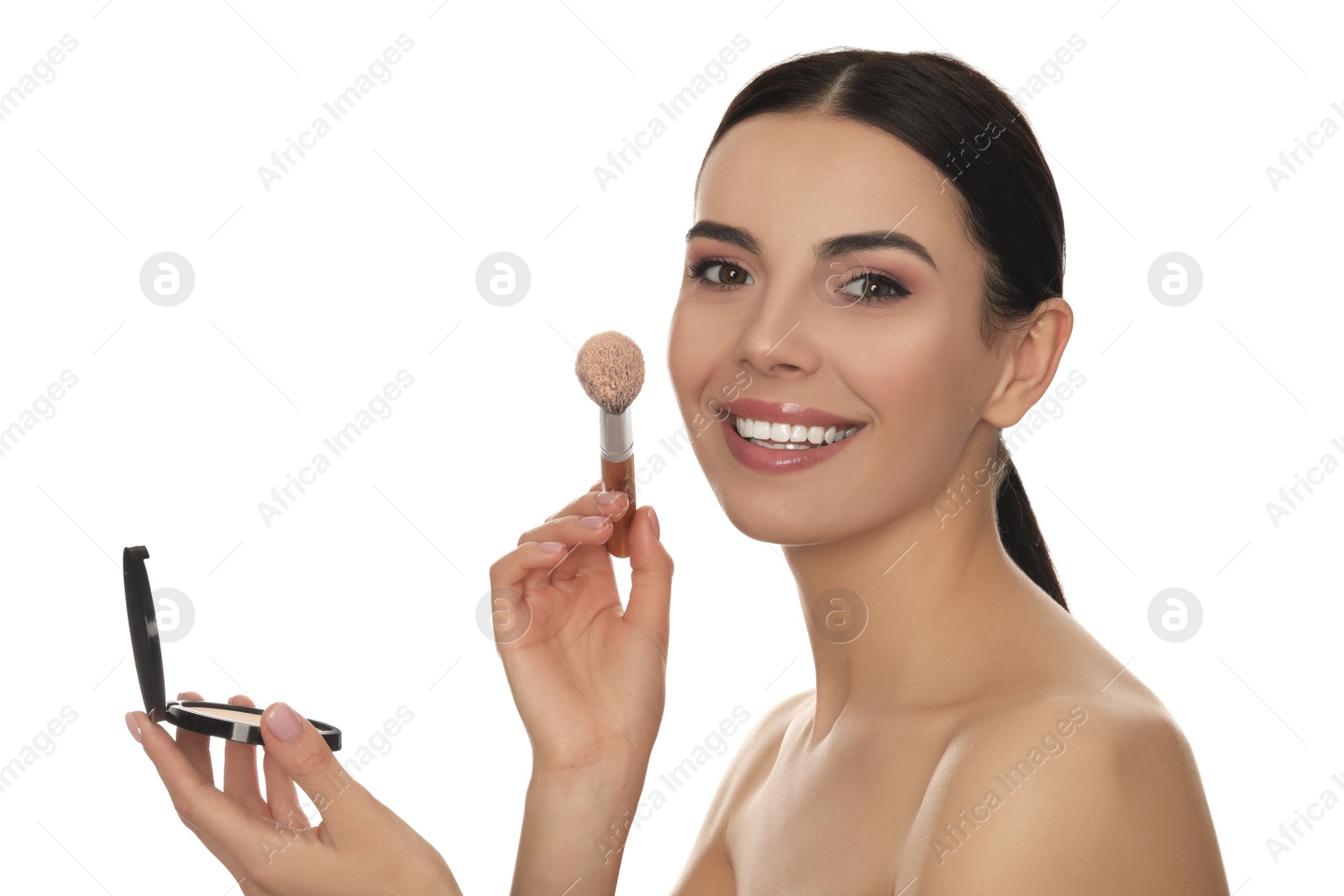 Photo of Beautiful young woman applying face powder with brush on white background