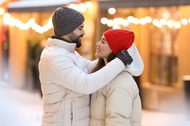 Photo of Lovely couple spending time together on city street