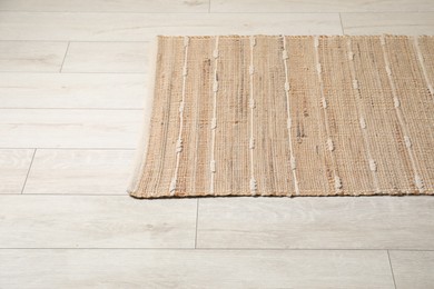 Photo of Soft carpet with pattern on white laminated floor indoors, space for text