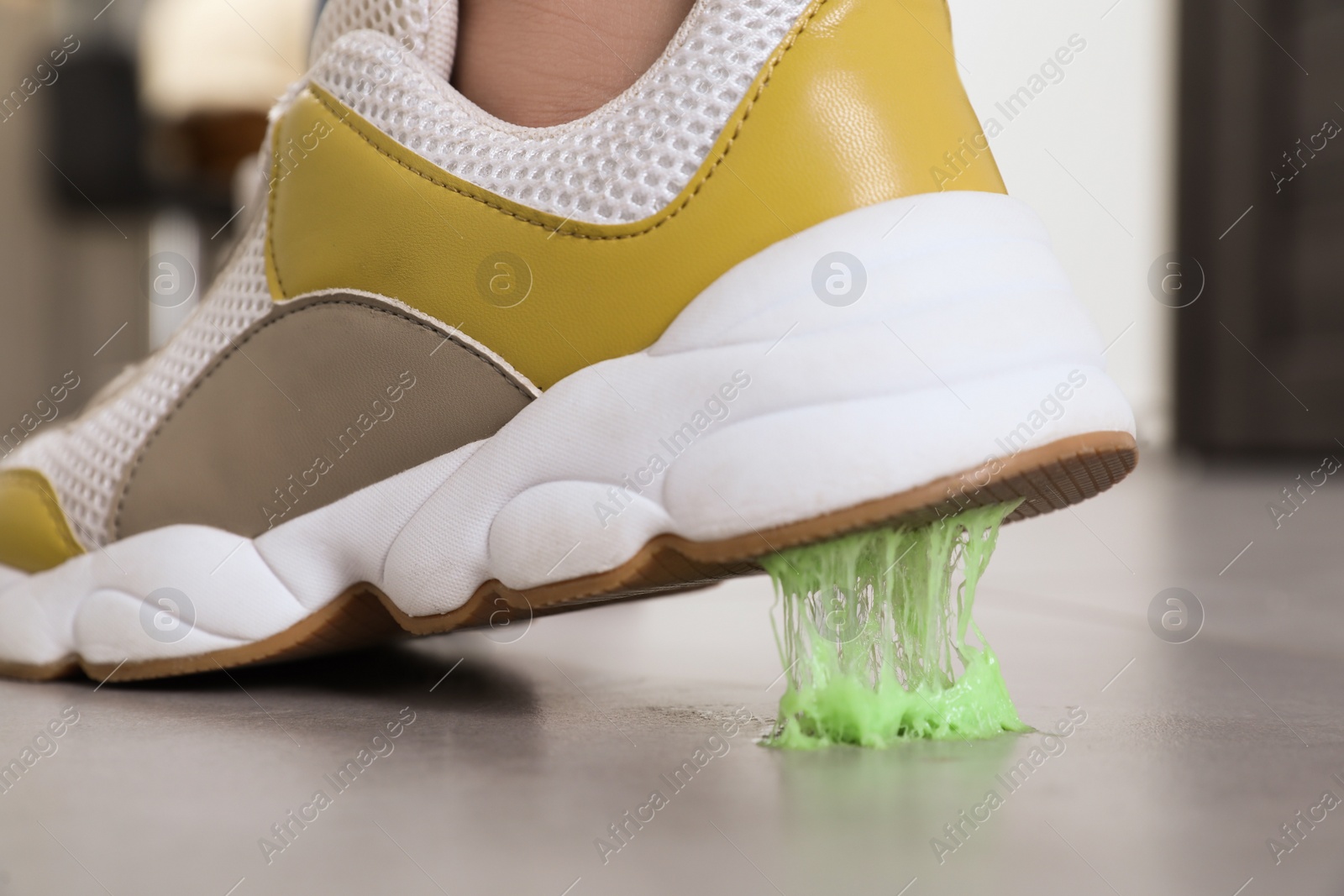 Photo of Person stepping into chewing gum on floor, closeup