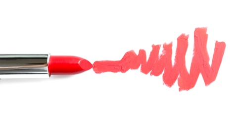 Photo of Tube of lipstick and smear isolated on white, top view