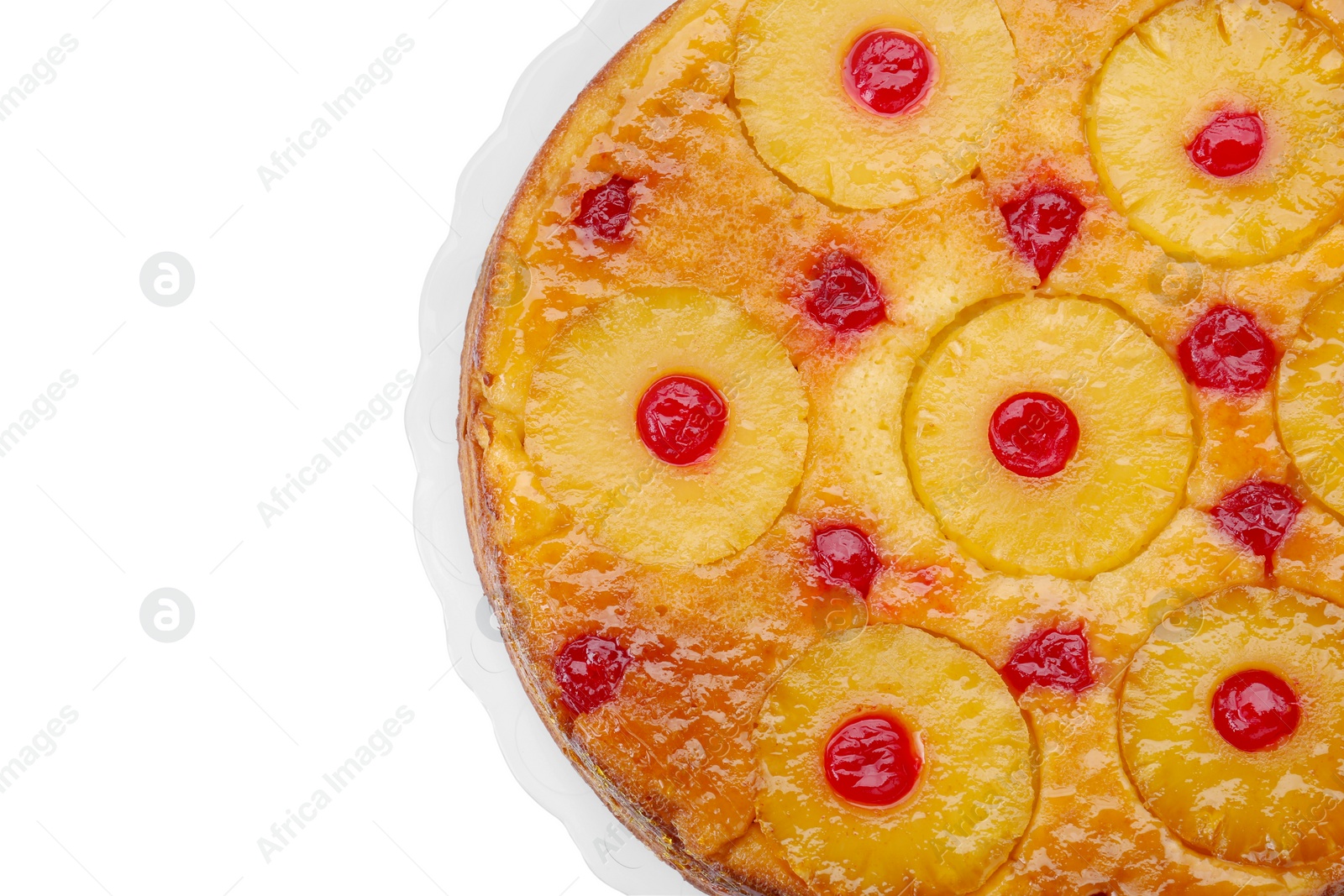 Photo of Plate with tasty pineapple cake isolated on white, top view