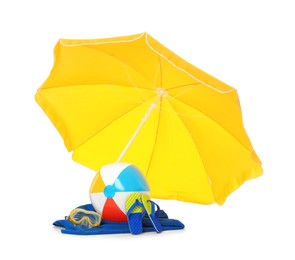 Open yellow beach umbrella, inflatable ball, towel, mask and flip flops on white background