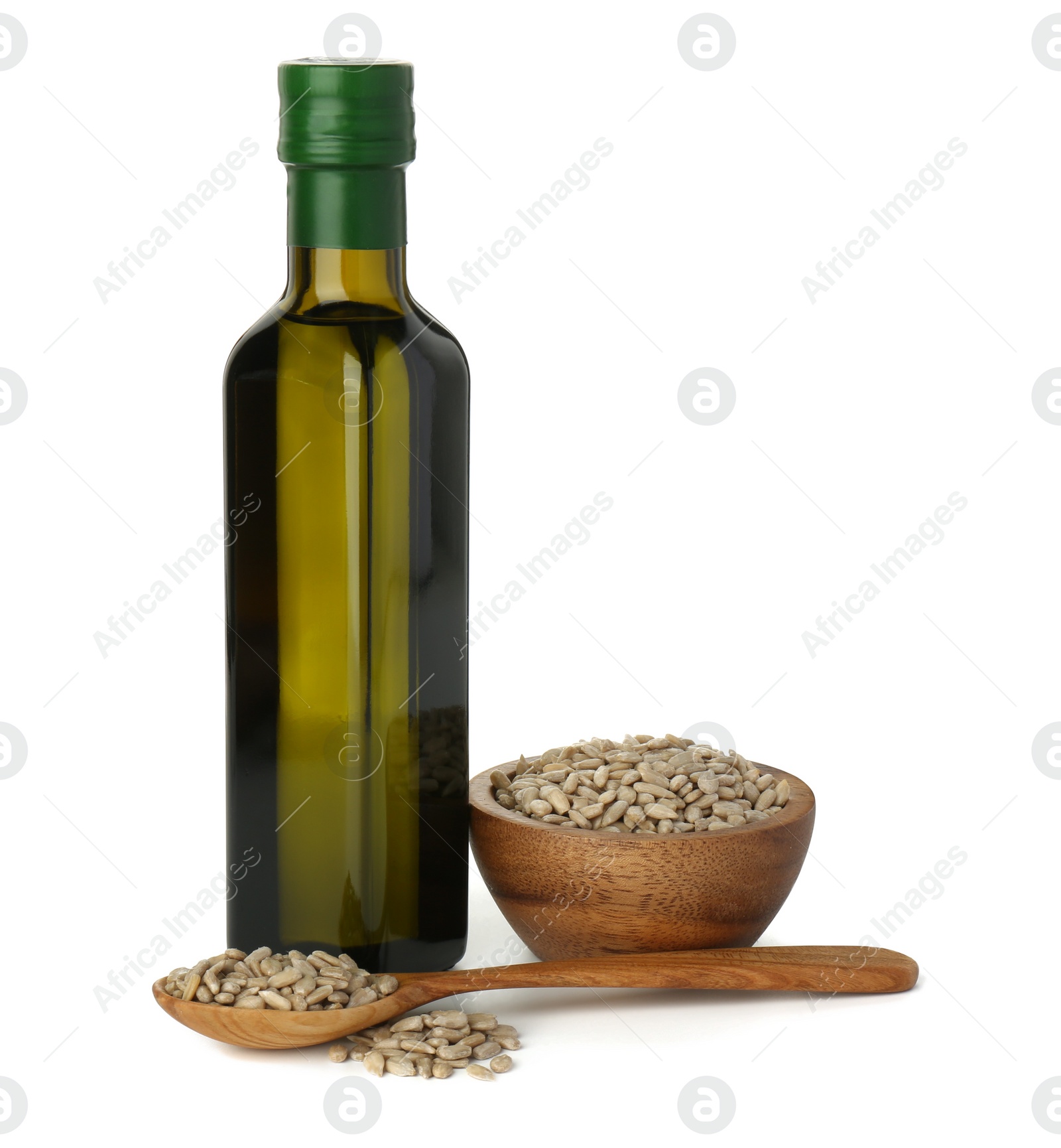 Photo of Vegetable fats. Sunflower oil in glass bottle and seeds isolated on white