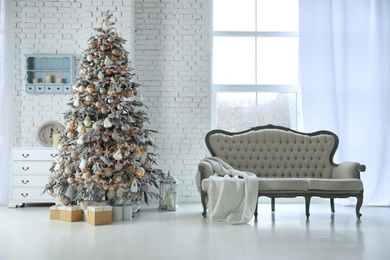 Beautiful interior of living room with decorated Christmas tree