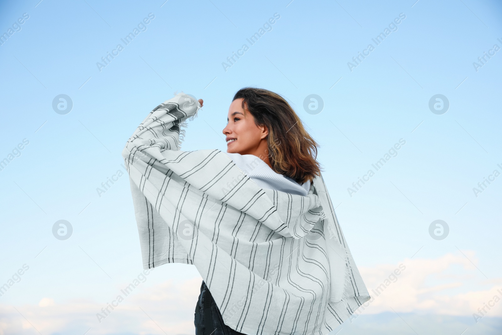 Photo of Portrait of beautiful young woman against blue sky