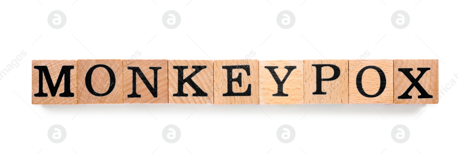 Photo of Word Monkeypox made of wooden cubes on white background, top view