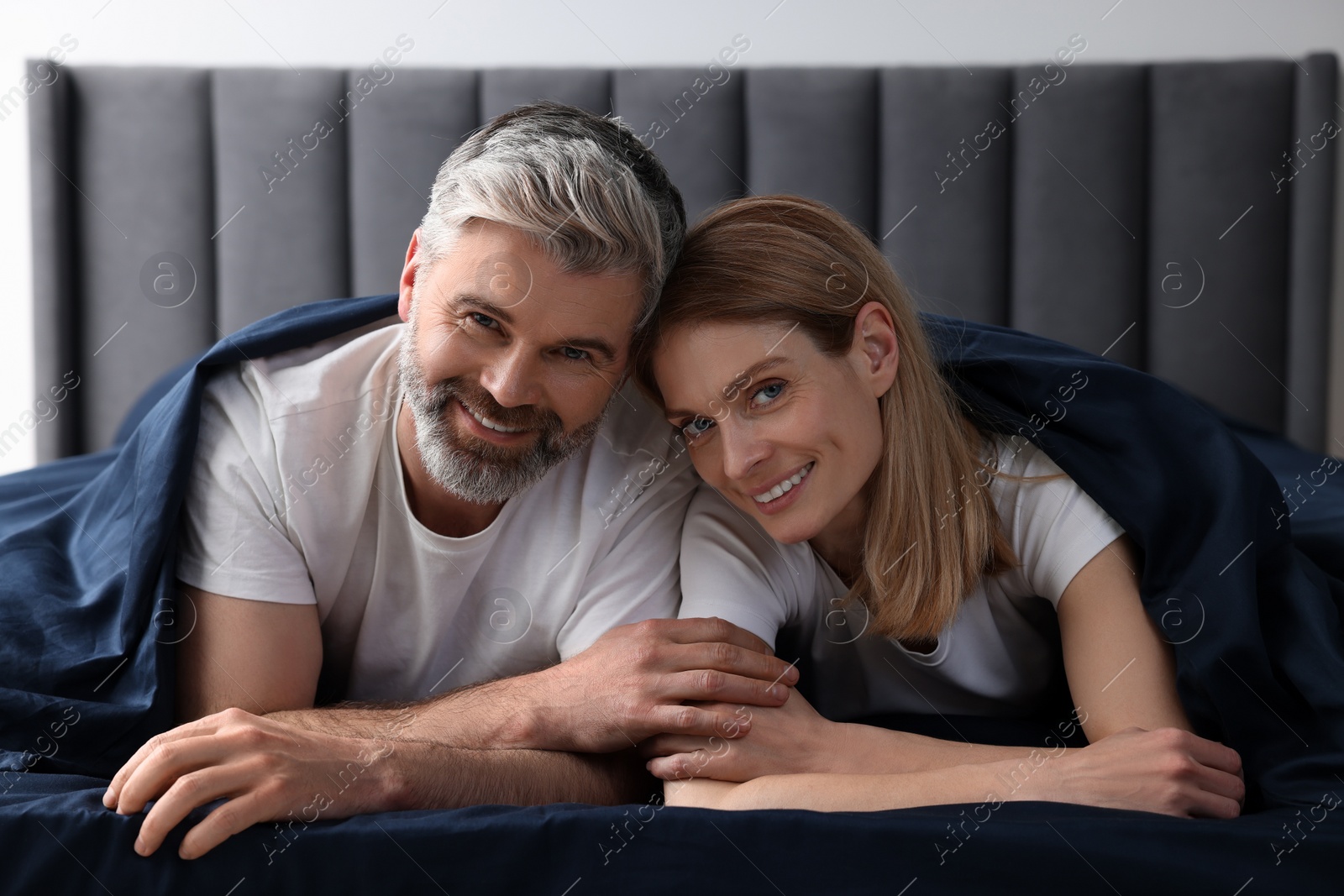 Photo of Lovely mature couple in bed at home