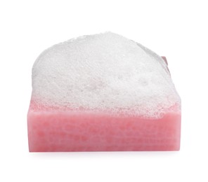 Soap bar with fluffy foam on white background