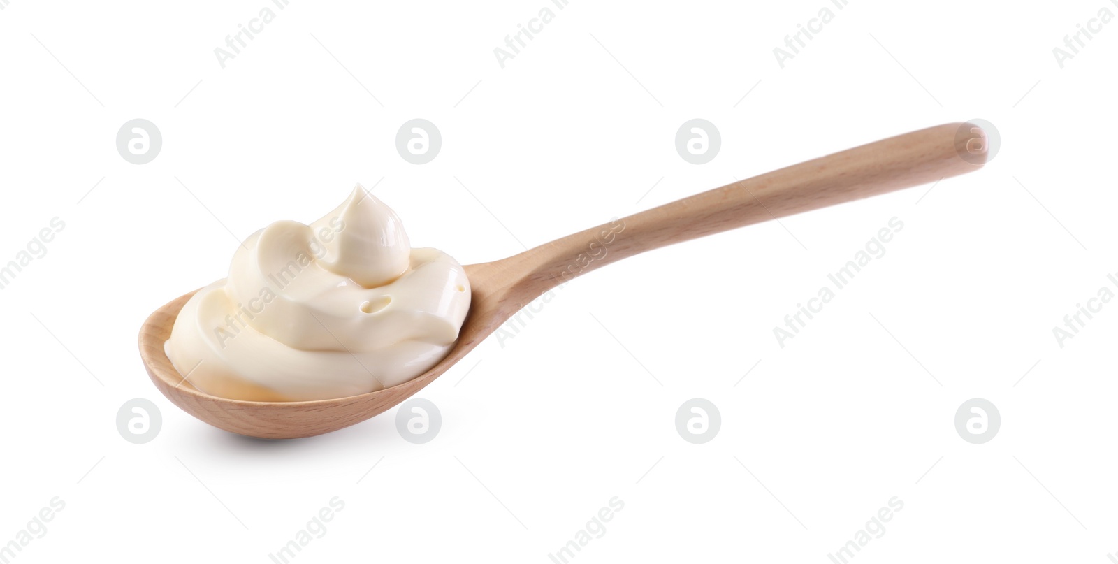 Photo of Natural yogurt in wooden spoon isolated on white