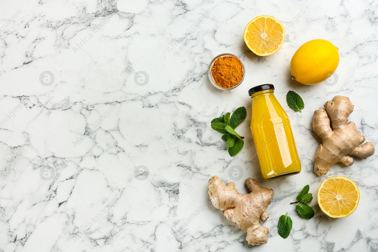 Photo of Flat lay composition with immunity boosting drink on marble table. Space for text