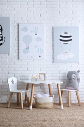 Photo of Baby room interior with toys and stylish furniture