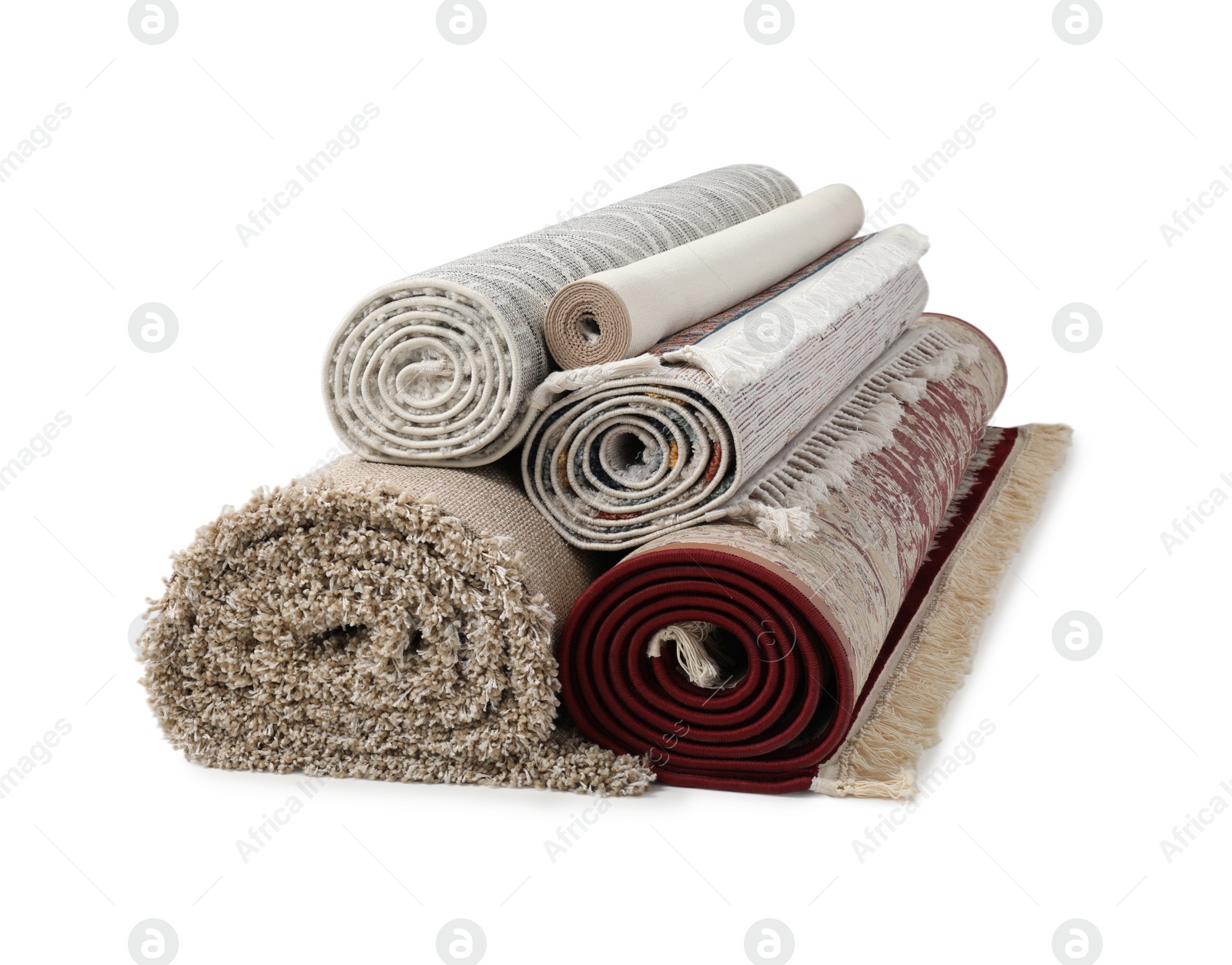 Photo of Rolled carpets on white background. Interior element