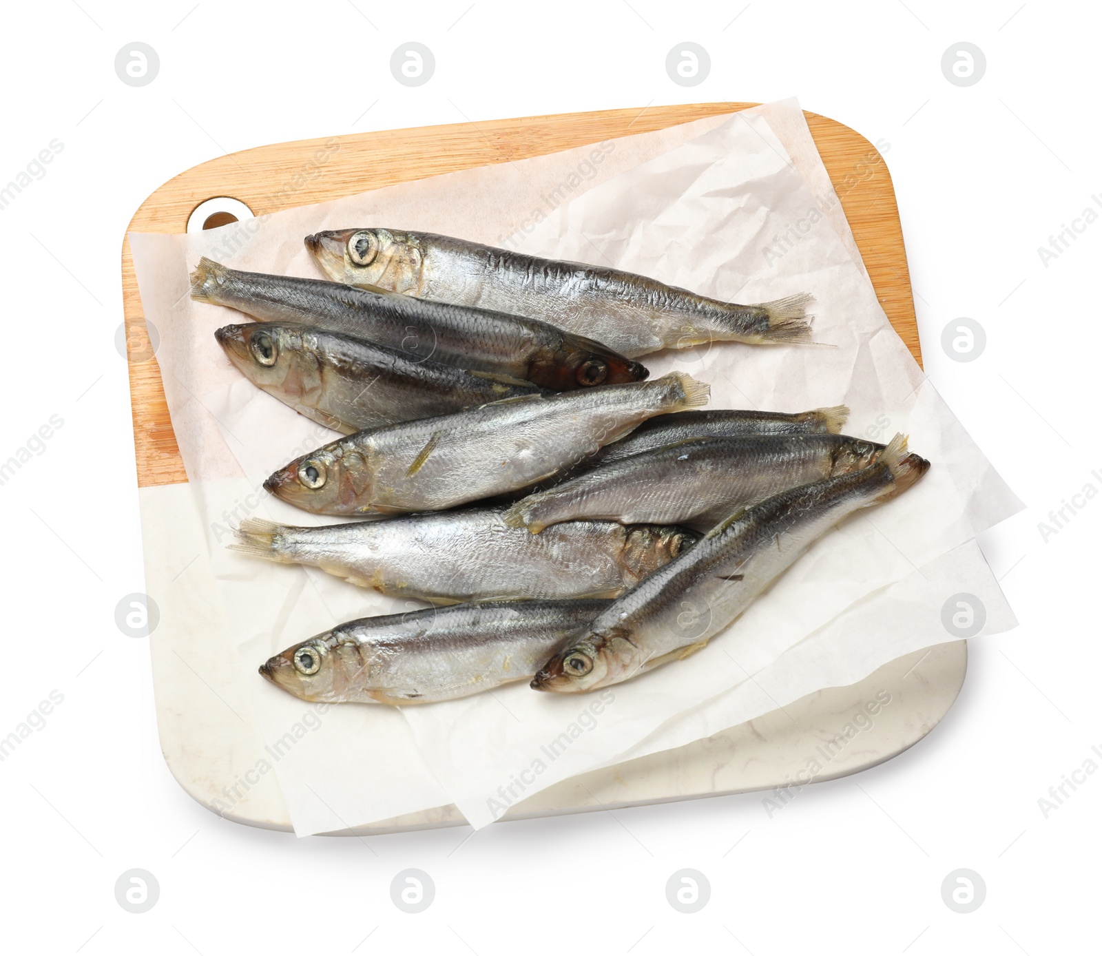 Photo of Fresh raw sprats isolated on white, top view