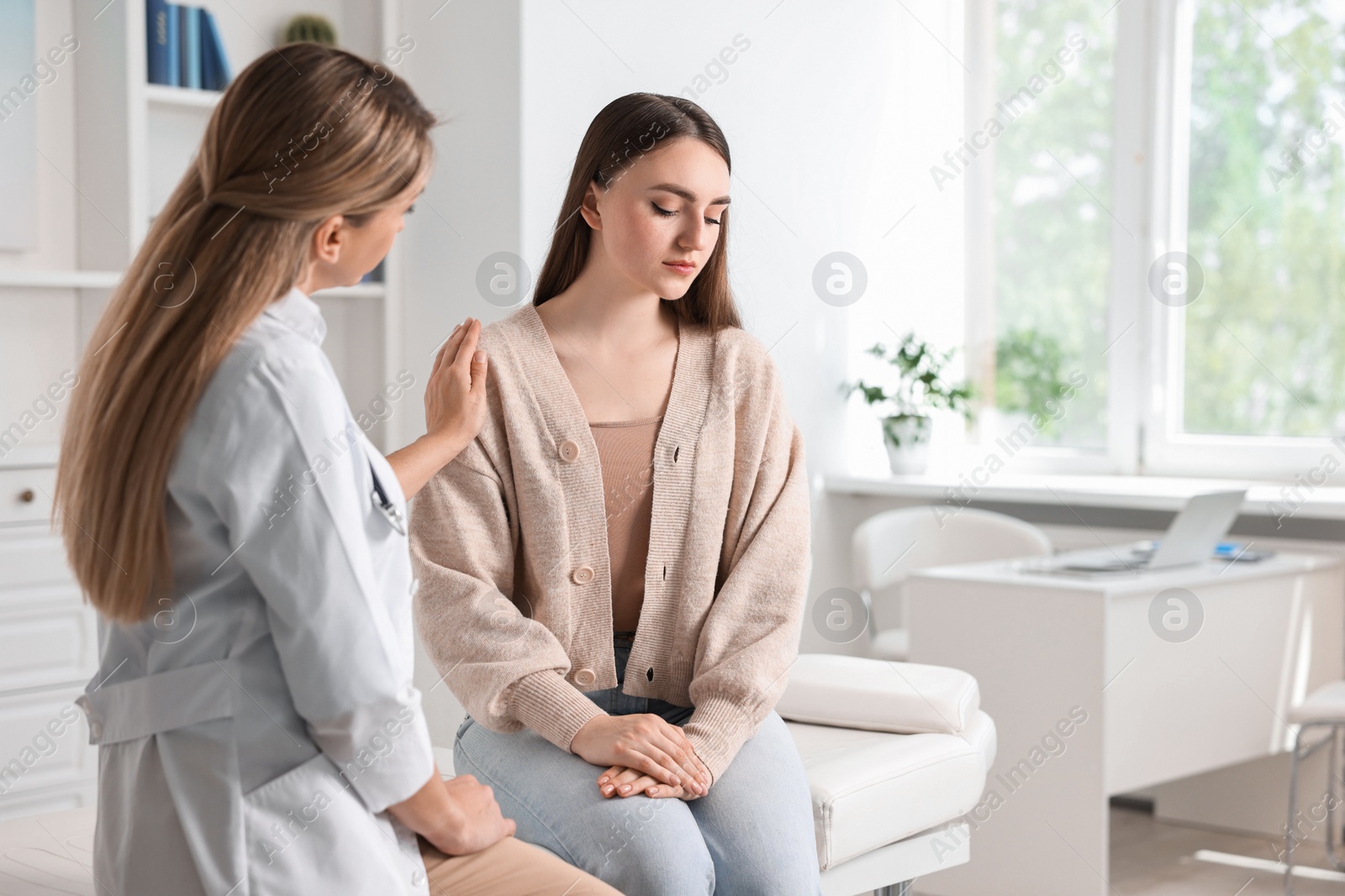 Photo of Professional doctor working with patient in hospital, space for text