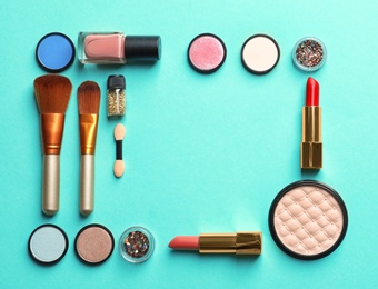 Photo of Flat lay composition with decorative cosmetics on color background