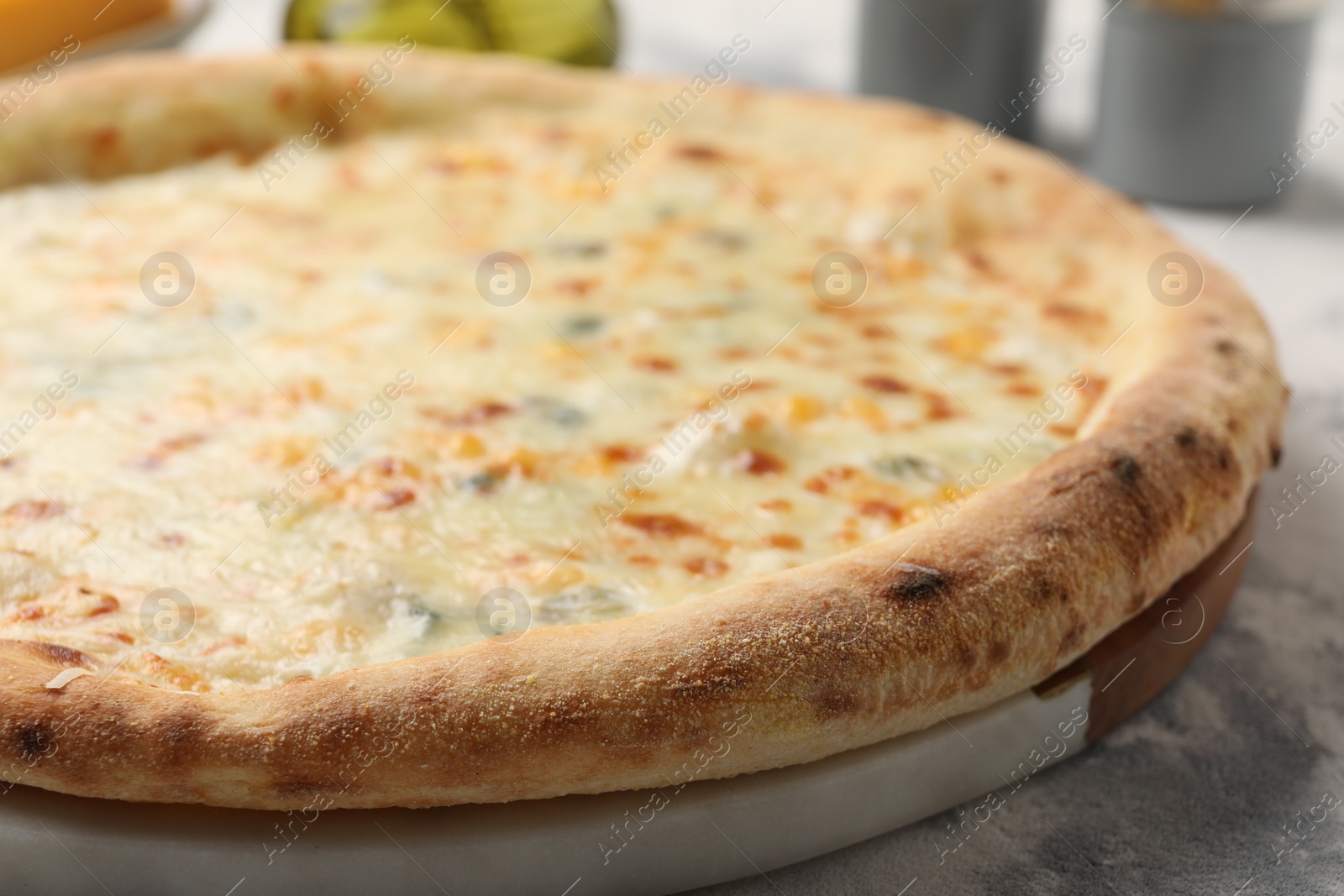 Photo of Delicious cheese pizza on table, closeup view