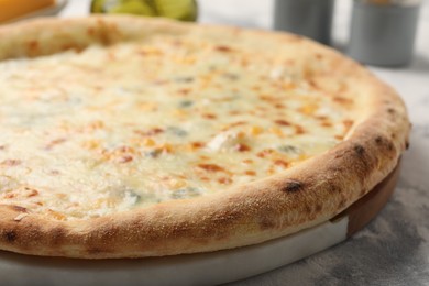 Photo of Delicious cheese pizza on table, closeup view