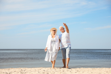 Mature couple spending time together on sea beach