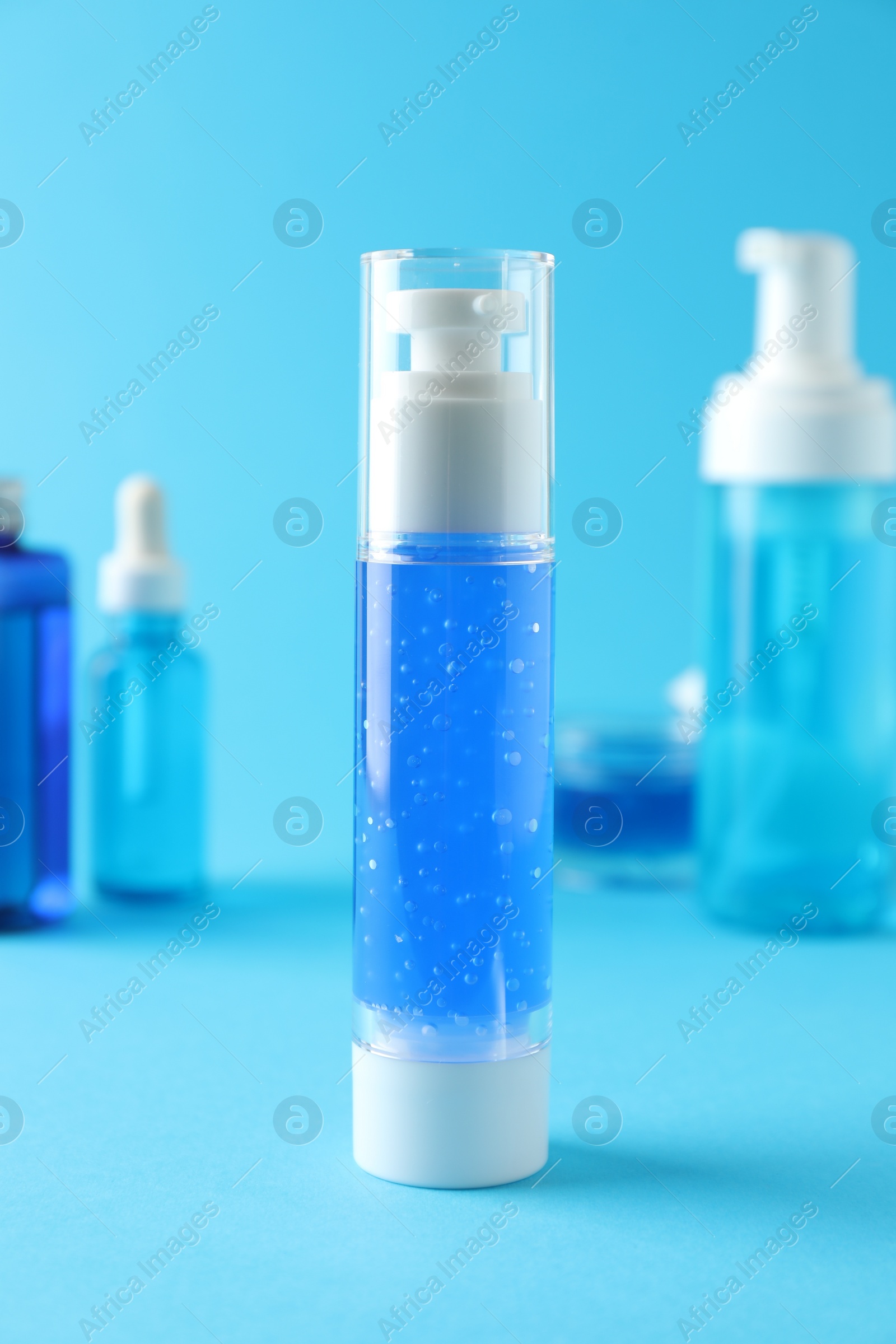 Photo of Different cosmetic products on light blue background