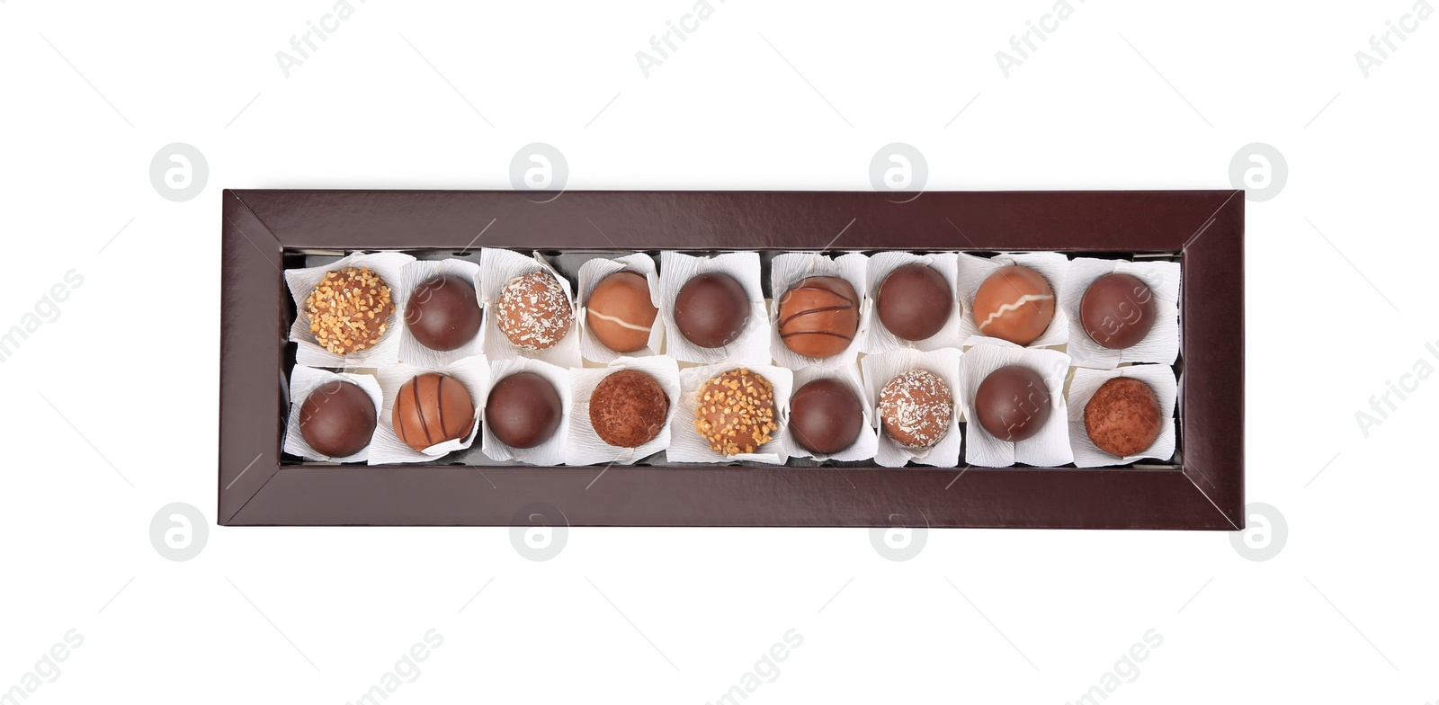 Photo of Box with delicious chocolate candies isolated on white, top view