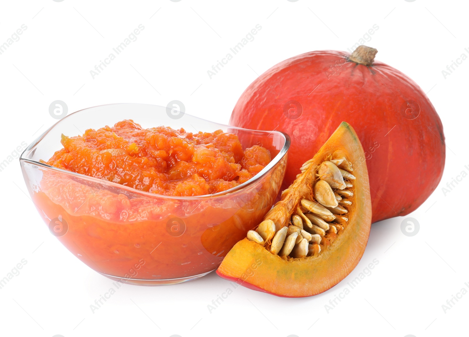 Photo of Glass bowl with pumpkin jam and fresh pumpkin on white background
