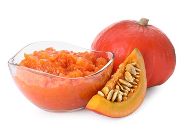 Glass bowl with pumpkin jam and fresh pumpkin on white background