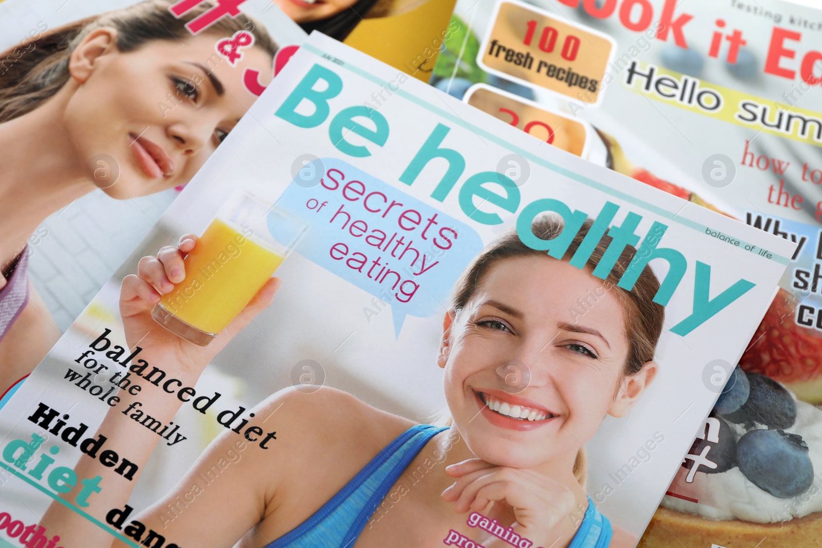 Photo of Variety of women's modern magazines, closeup view