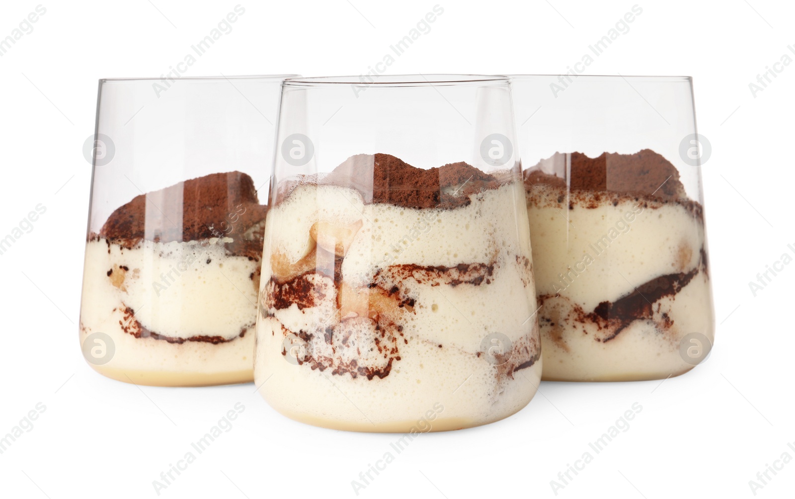 Photo of Delicious tiramisu in glasses isolated on white