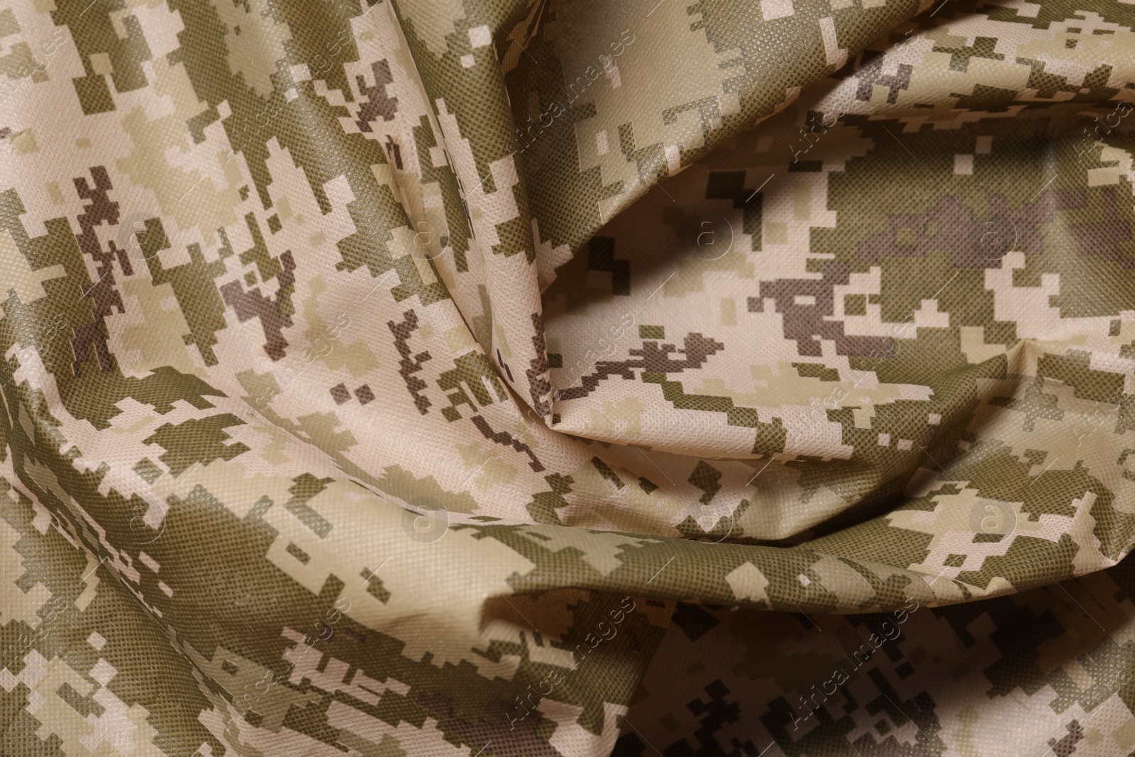 Photo of Texture of crumpled camouflage fabric as background, top view