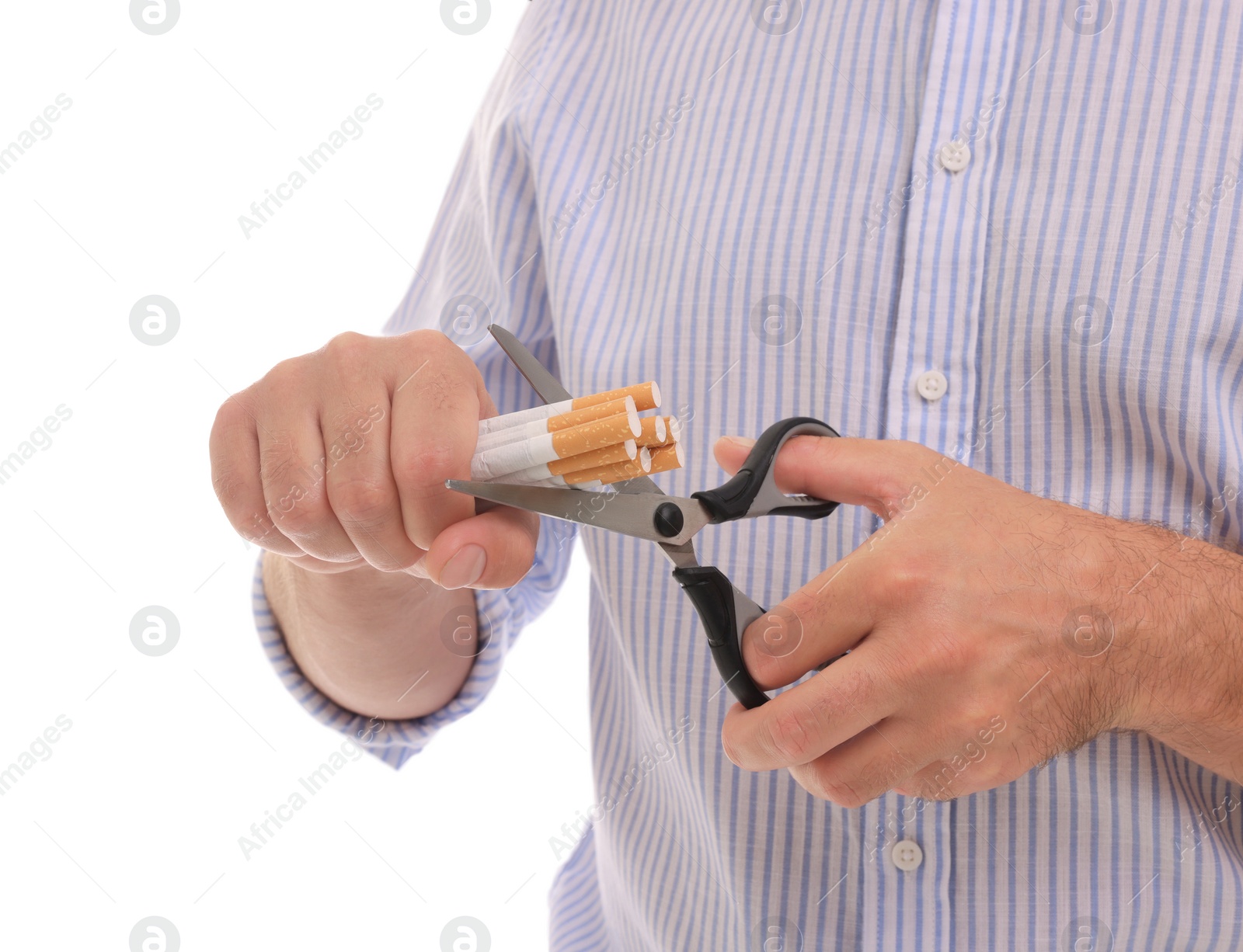 Photo of Stop smoking concept. Man cutting cigarettes on white background, closeup