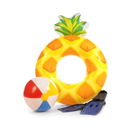 Photo of Bright inflatable ring, beach ball and flippers on white background