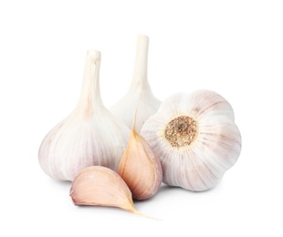 Fresh organic garlic bulbs and cloves on white background