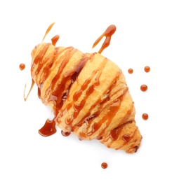 Photo of Tasty croissant with sauce on white background, top view