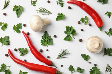 Flat lay composition with green parsley, rosemary, pepper and mushrooms on white background