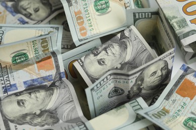 Photo of Money exchange. Dollar banknotes as background, closeup