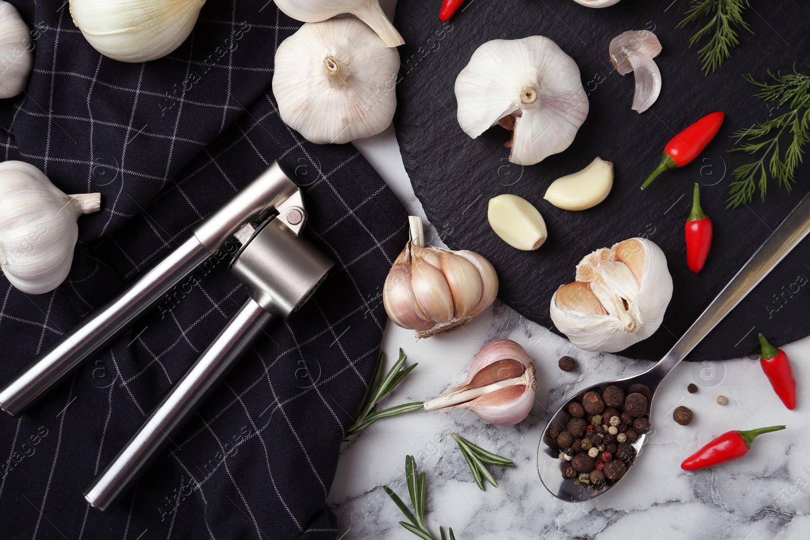 Photo of Flat lay composition with garlic and peppers on marble table