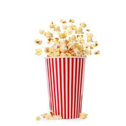 Popcorn flying into bucket on white background