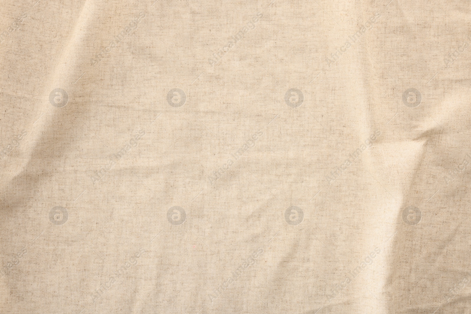 Photo of Texture of natural burlap fabric as background, top view