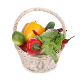 Photo of Fresh ripe vegetables and fruit in wicker basket on white background