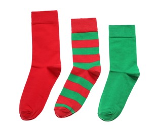 Photo of Different colorful socks on white background, top view