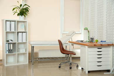 Photo of Modern interior of doctor's office with workplace