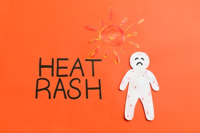 Photo of Words Heat Rash, human cutout and sun on orange background, flat lay