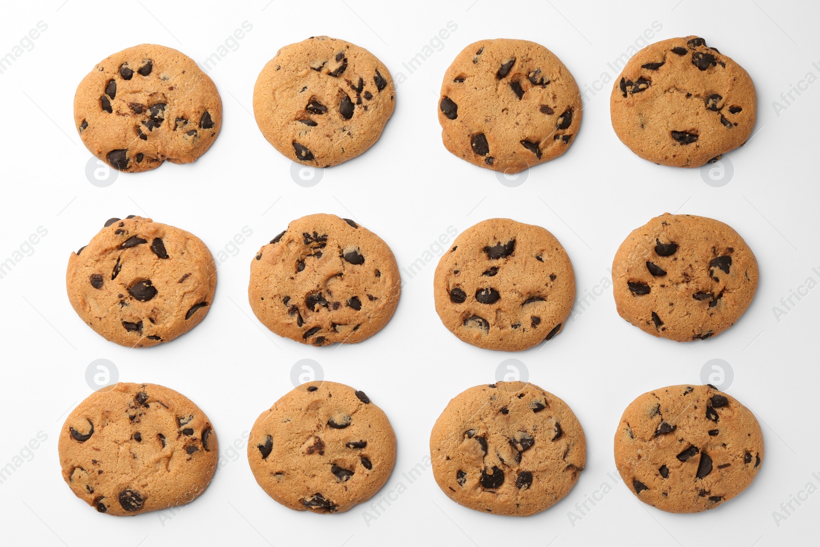 Photo of Many delicious chocolate chip cookies on white background, flat lay