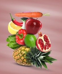 Image of Stack of different vegetables and fruits on pale dusty pink background