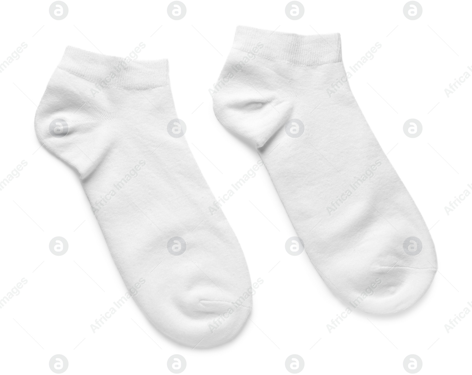 Photo of Pair of socks isolated on white, top view