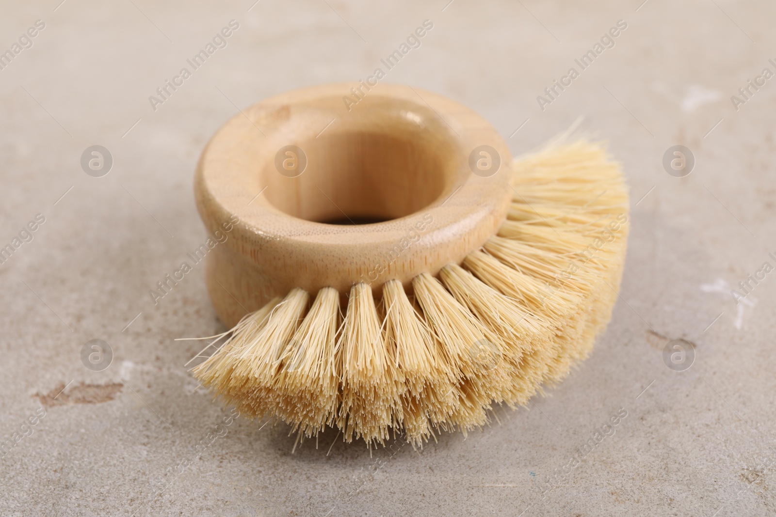 Photo of Cleaning brush on light grey table, closeup