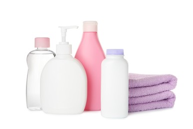 Photo of Set of baby cosmetic products and towels on white background