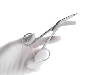 Photo of Doctor holding surgical scissors on white background, closeup. Medical instrument